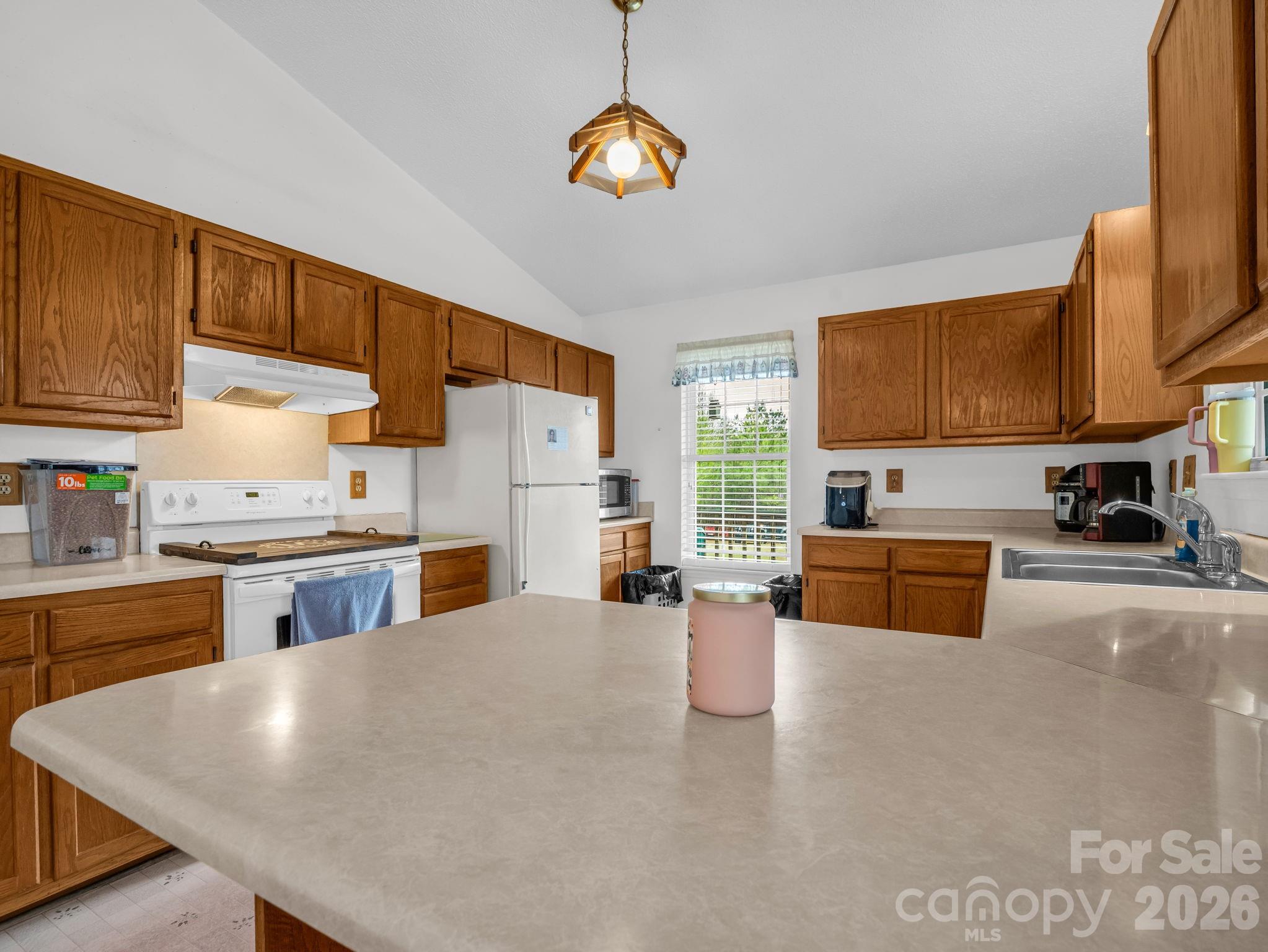 308 Frog Hollow Road Rutherfordton, NC 28139 - Photo 12 of 26 a large kitchen with stainless steel appliances granite countertop a stove refrigerator and a sink