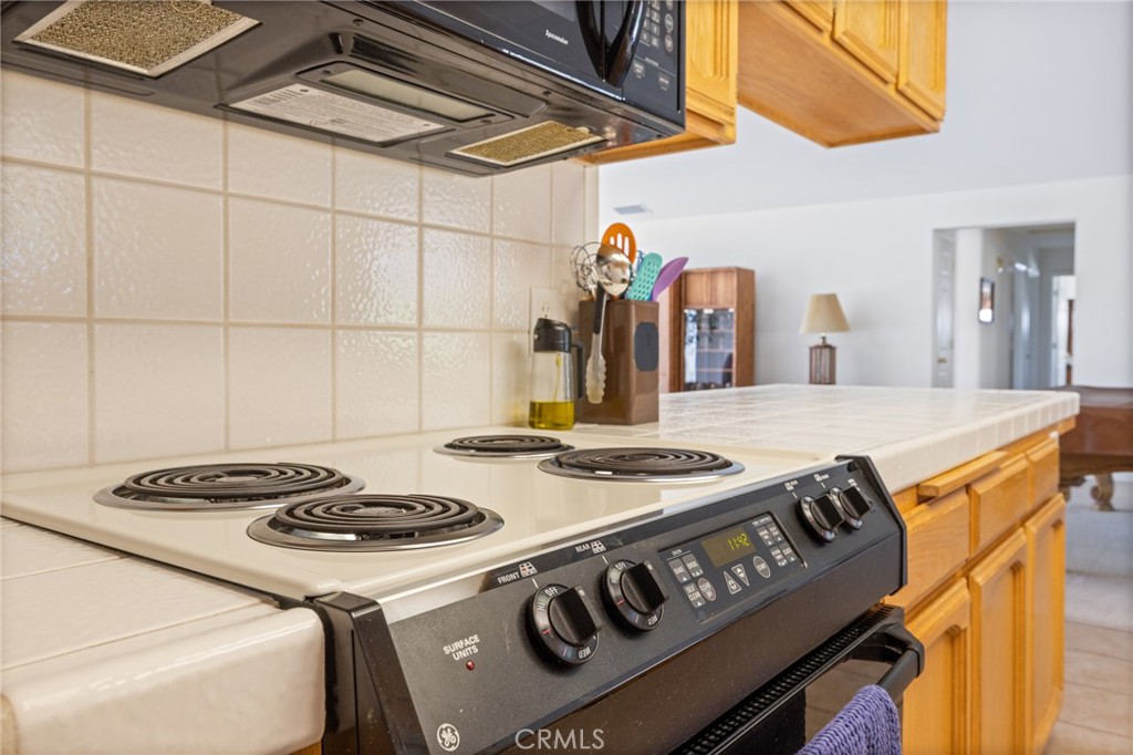 50174 Bissett Station Road Oakhurst, CA 93644 - Photo 12 of 75 a kitchen with a stove and a sink