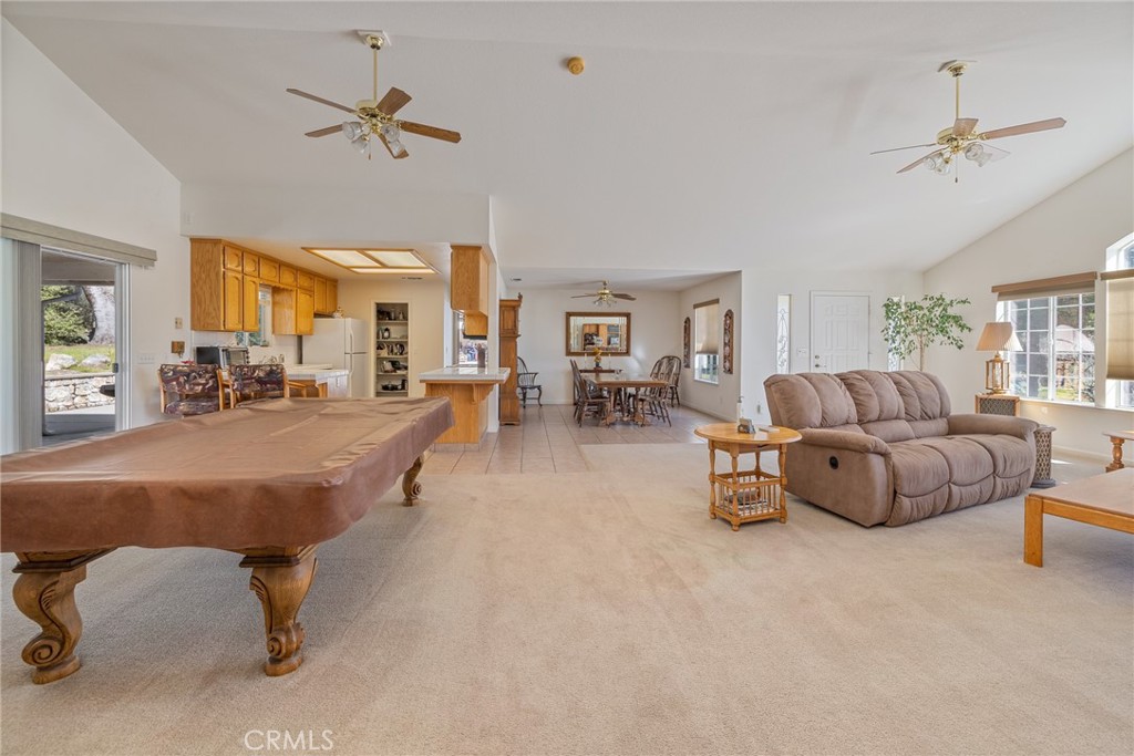 50174 Bissett Station Road Oakhurst, CA 93644 - Photo 15 of 75 a living room with furniture and a chandelier