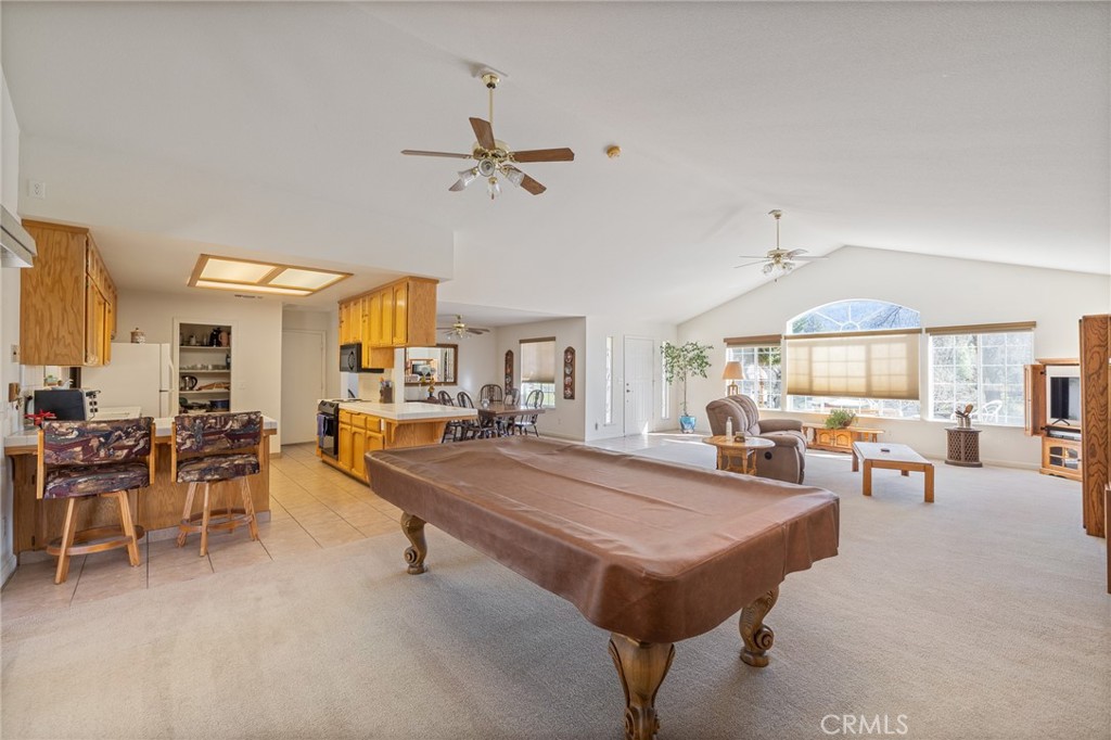 50174 Bissett Station Road Oakhurst, CA 93644 - Photo 17 of 75 a view of a livingroom with furniture and a table
