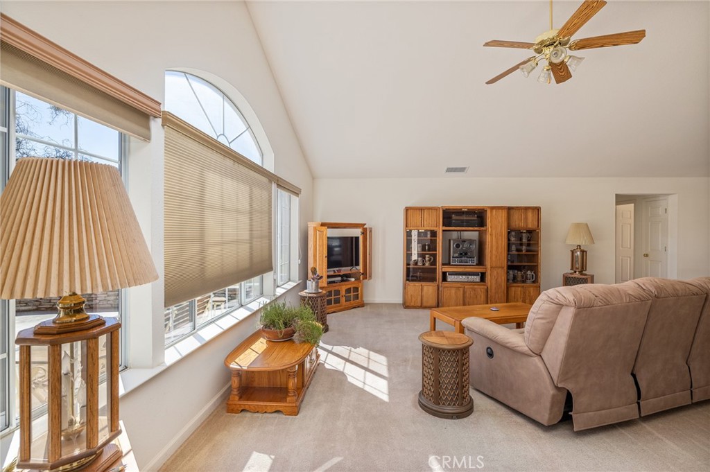 50174 Bissett Station Road Oakhurst, CA 93644 - Photo 21 of 75 a living room with furniture and a large window