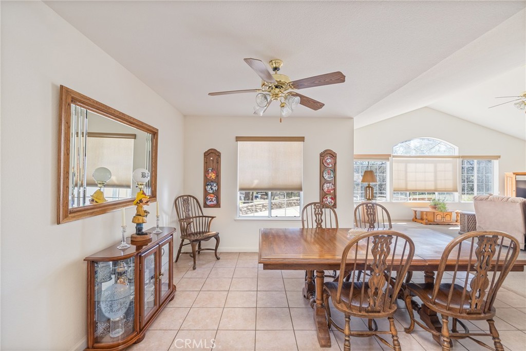 50174 Bissett Station Road Oakhurst, CA 93644 - Photo 23 of 75 a view of a dining room with furniture window and outside view