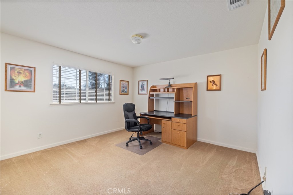 50174 Bissett Station Road Oakhurst, CA 93644 - Photo 24 of 75 a view of a workspace with furniture and a window