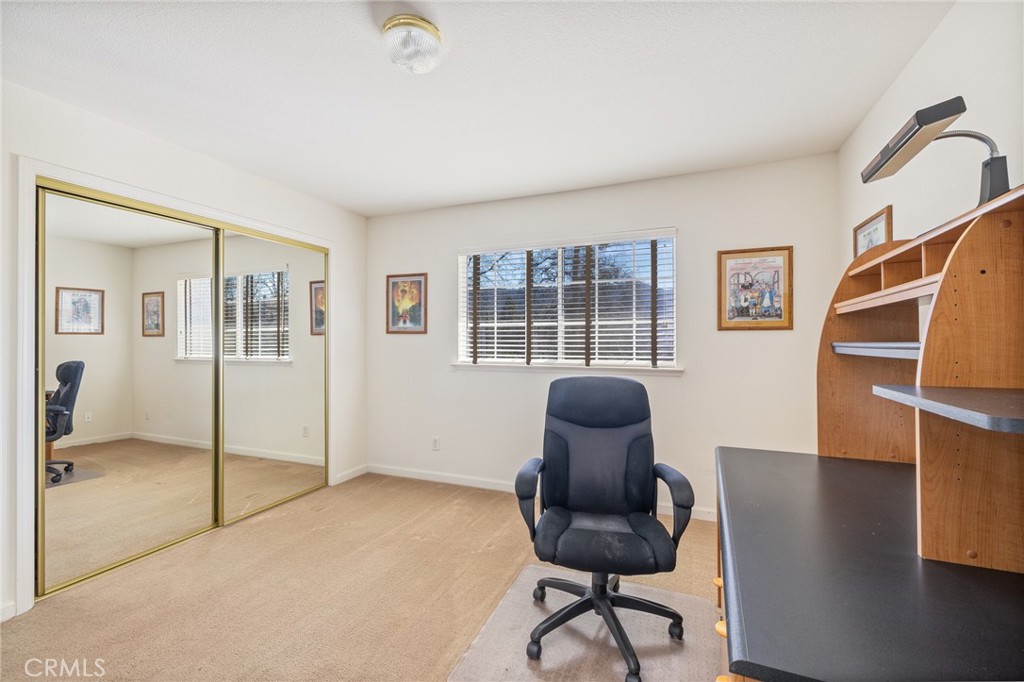 50174 Bissett Station Road Oakhurst, CA 93644 - Photo 26 of 75 a workspace room with furniture and wooden floor