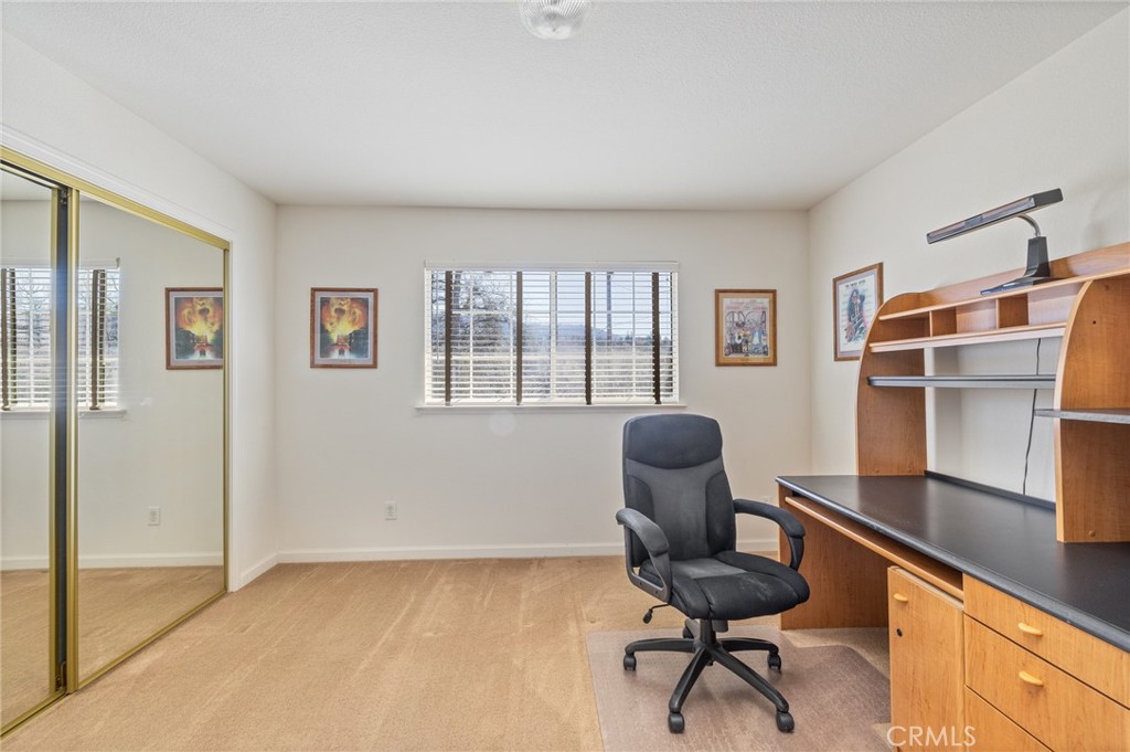 50174 Bissett Station Road Oakhurst, CA 93644 - Photo 27 of 75 a view of a workspace with furniture and a window