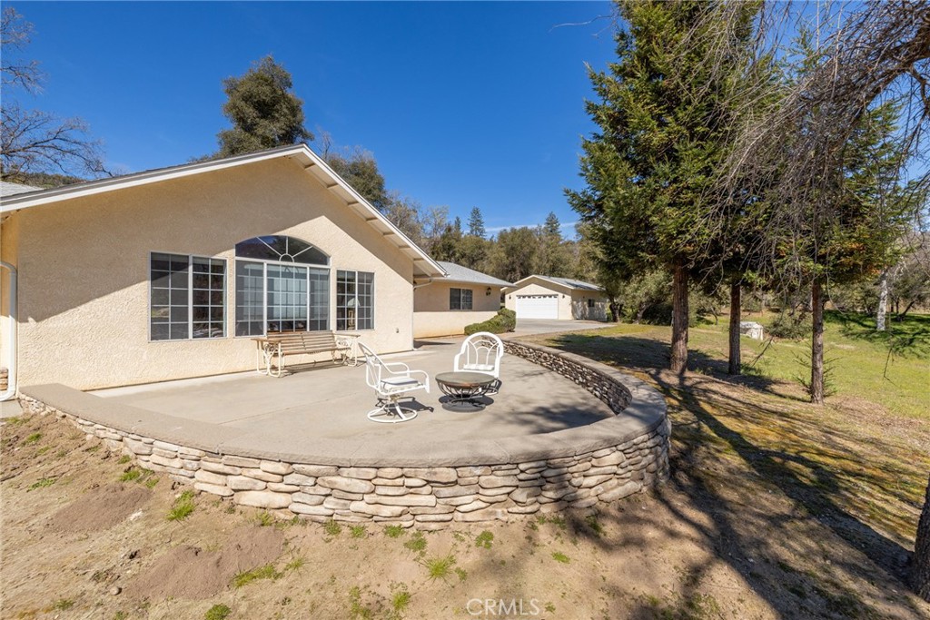50174 Bissett Station Road Oakhurst, CA 93644 - Photo 55 of 75 a view of a house with snow on the background