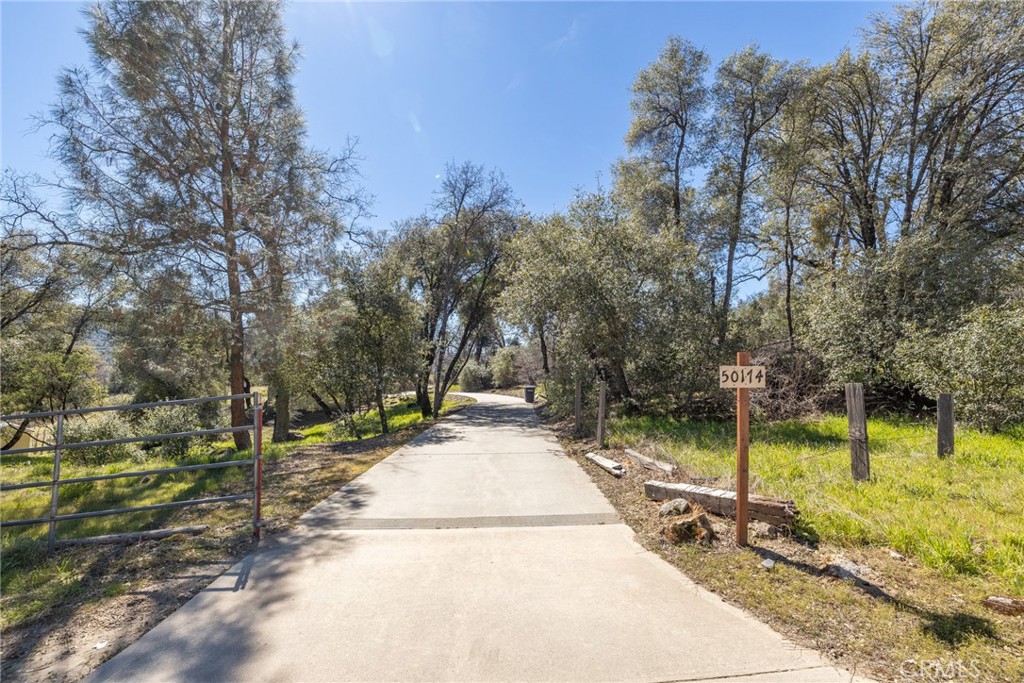 50174 Bissett Station Road Oakhurst, CA 93644 - Photo 61 of 75 a view of a yard with swimming pool