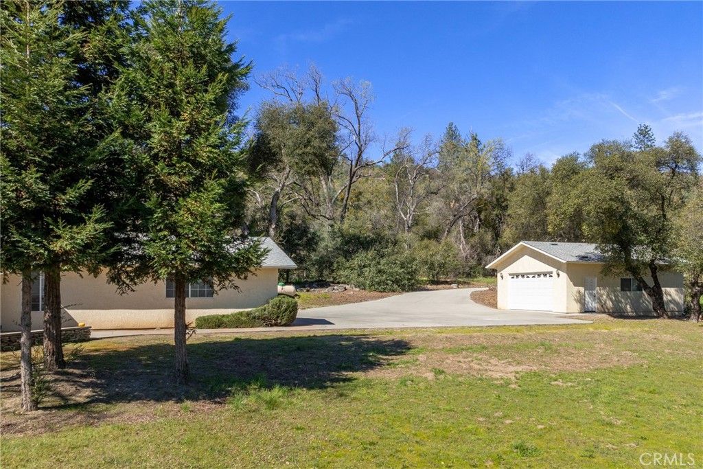 50174 Bissett Station Road Oakhurst, CA 93644 - Photo 73 of 75 a view of a house with a yard