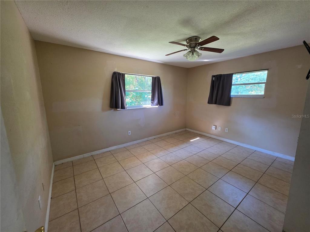 5905 Altec Road Orlando, FL 32808 - Photo 5 of 9 a view of an empty room