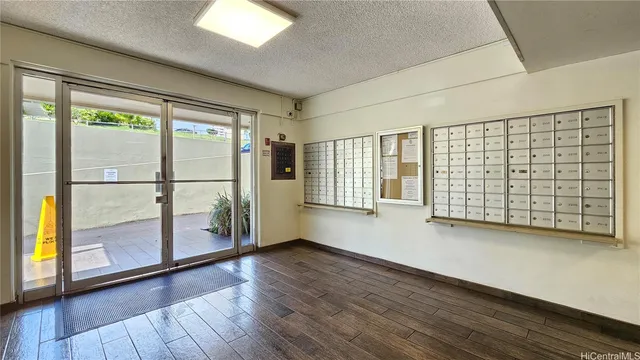 a view of front door with wooden floor
