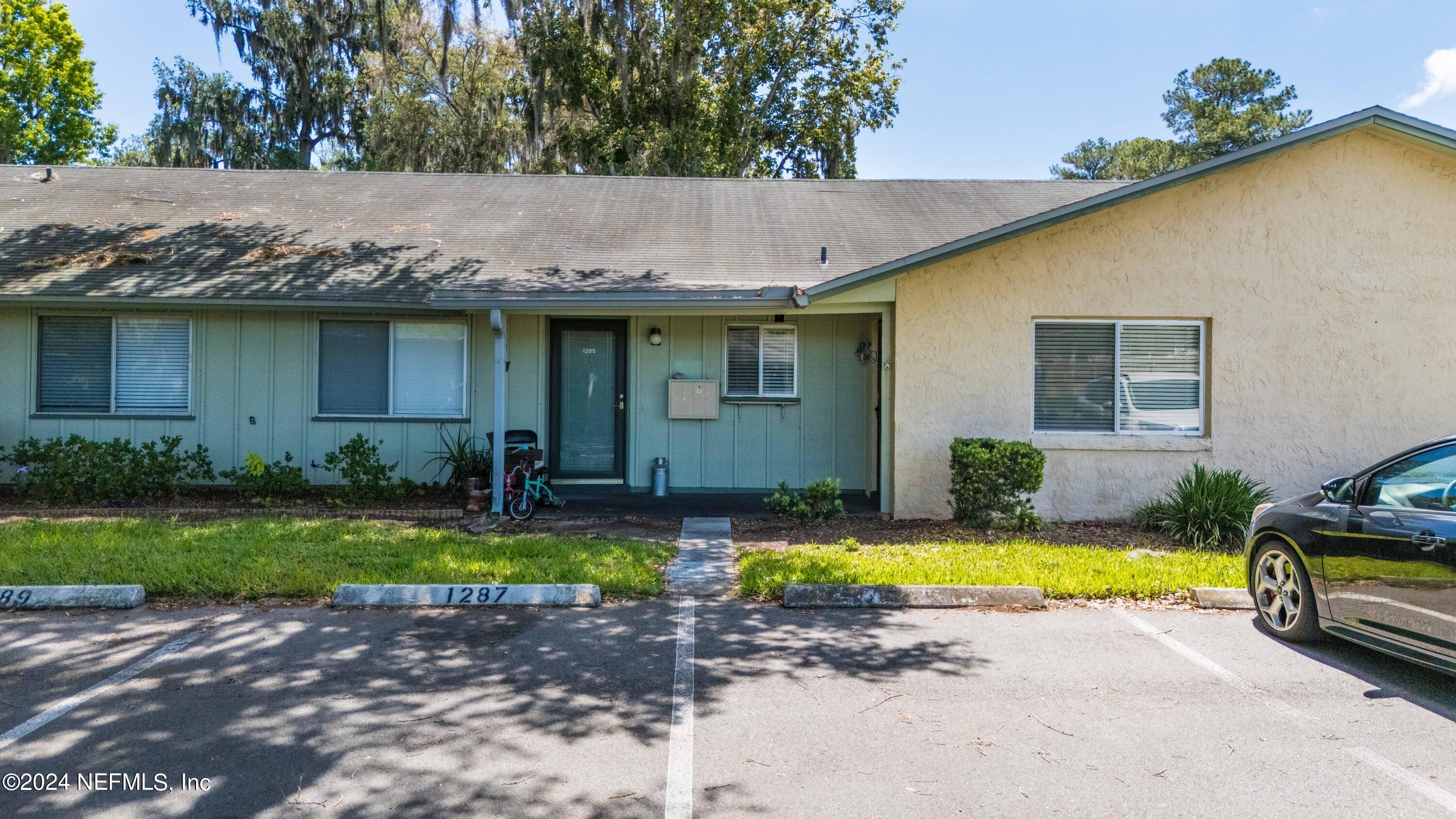 1283 The Grove Road Orange Park, FL 32073 - Photo 1 of 49 a view of a house with swimming pool and sitting area