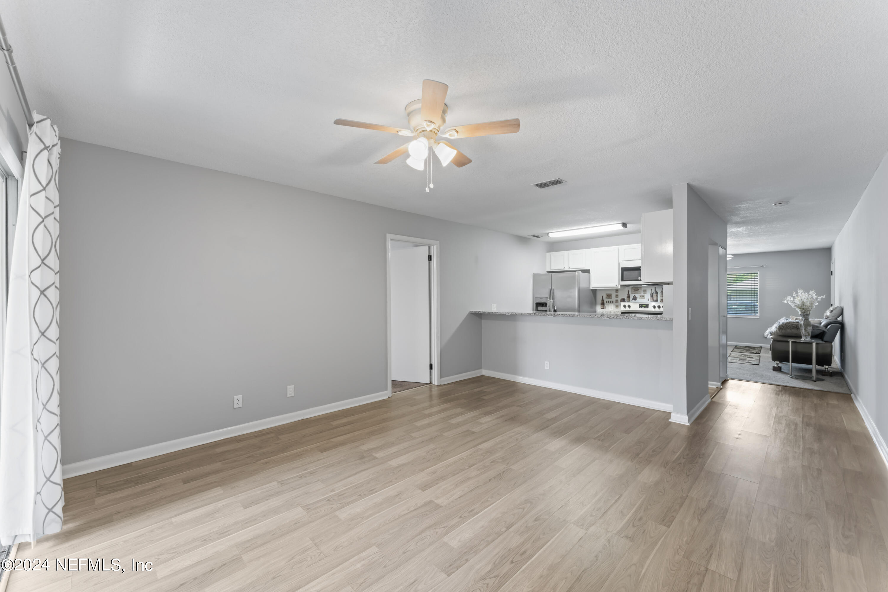 1283 The Grove Road Orange Park, FL 32073 - Photo 12 of 49 a view of a livingroom with a kitchen