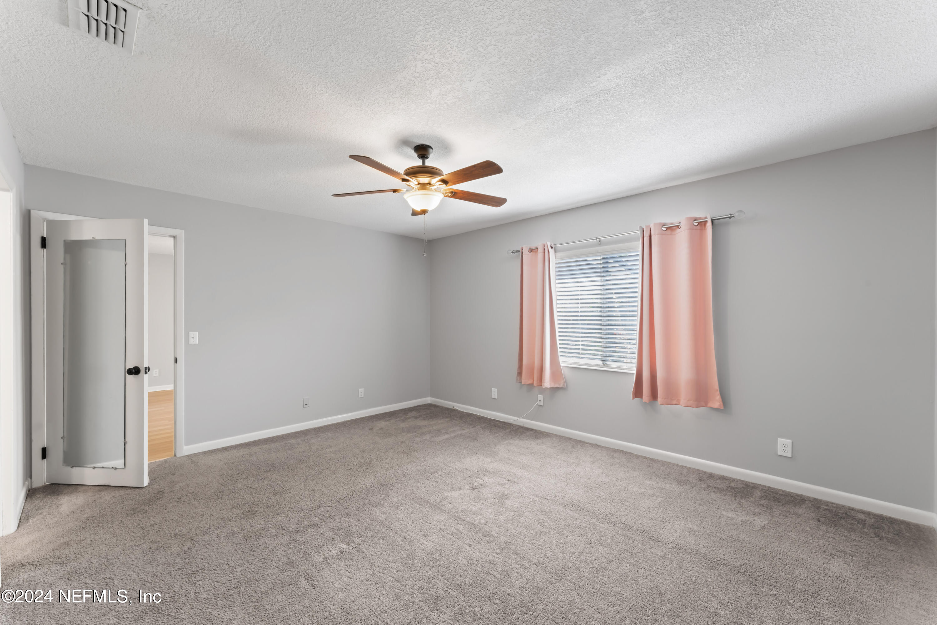 1283 The Grove Road Orange Park, FL 32073 - Photo 18 of 49 a view of an empty room with a window