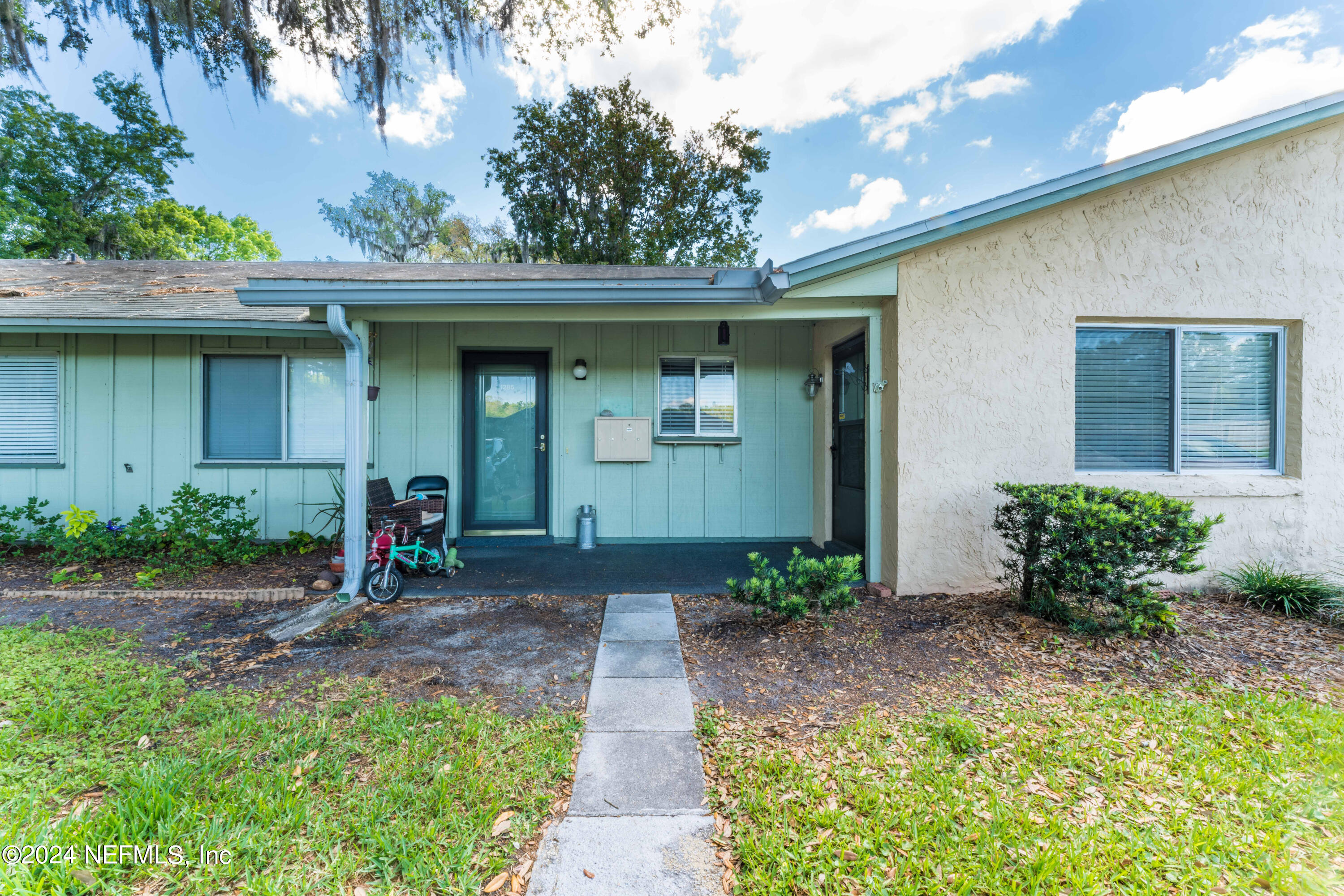 1283 The Grove Road Orange Park, FL 32073 - Photo 2 of 49 a front view of a house with a yard