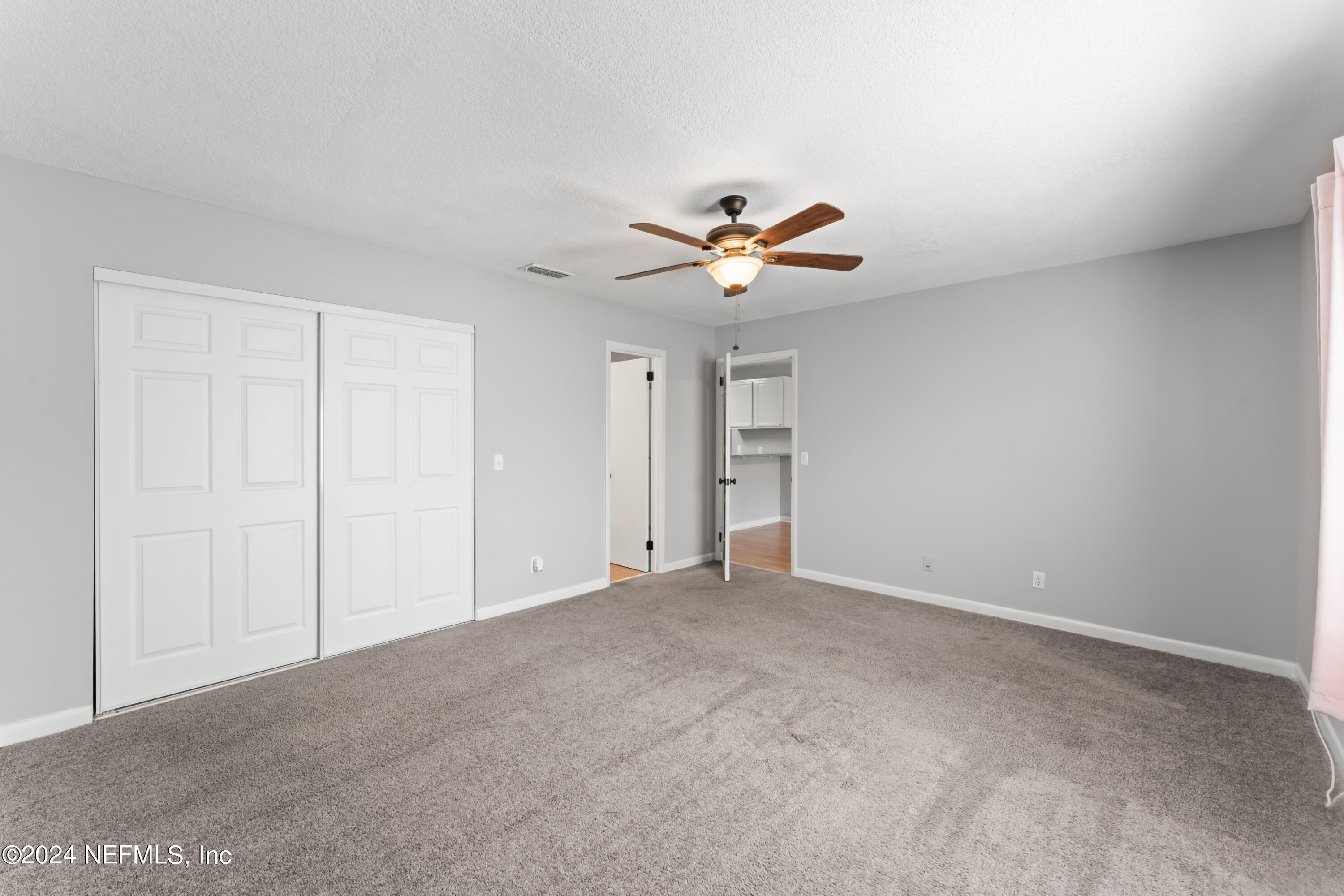 1283 The Grove Road Orange Park, FL 32073 - Photo 23 of 49 a view of an empty room with a window
