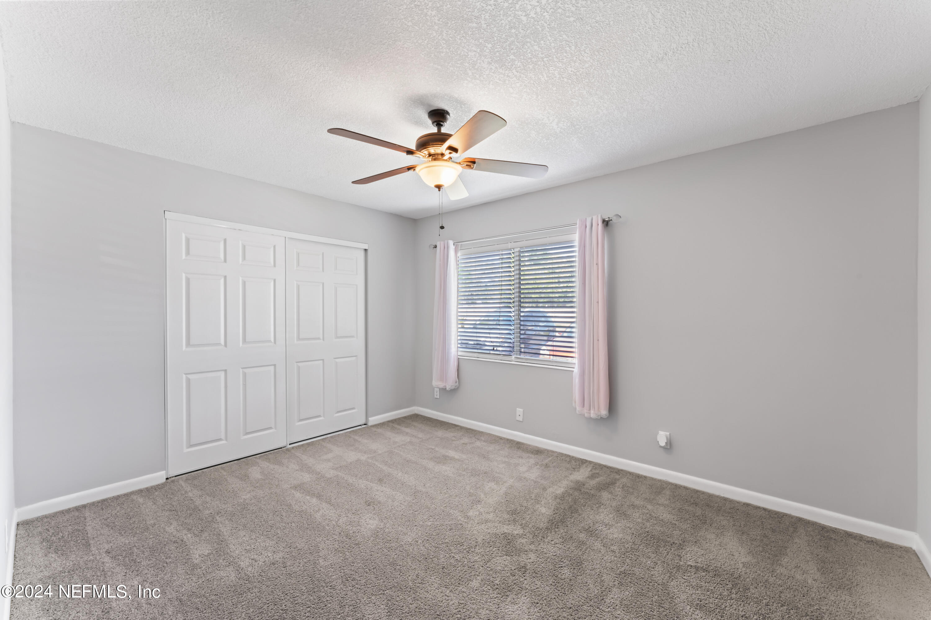 1283 The Grove Road Orange Park, FL 32073 - Photo 24 of 49 a view of an empty room with a window