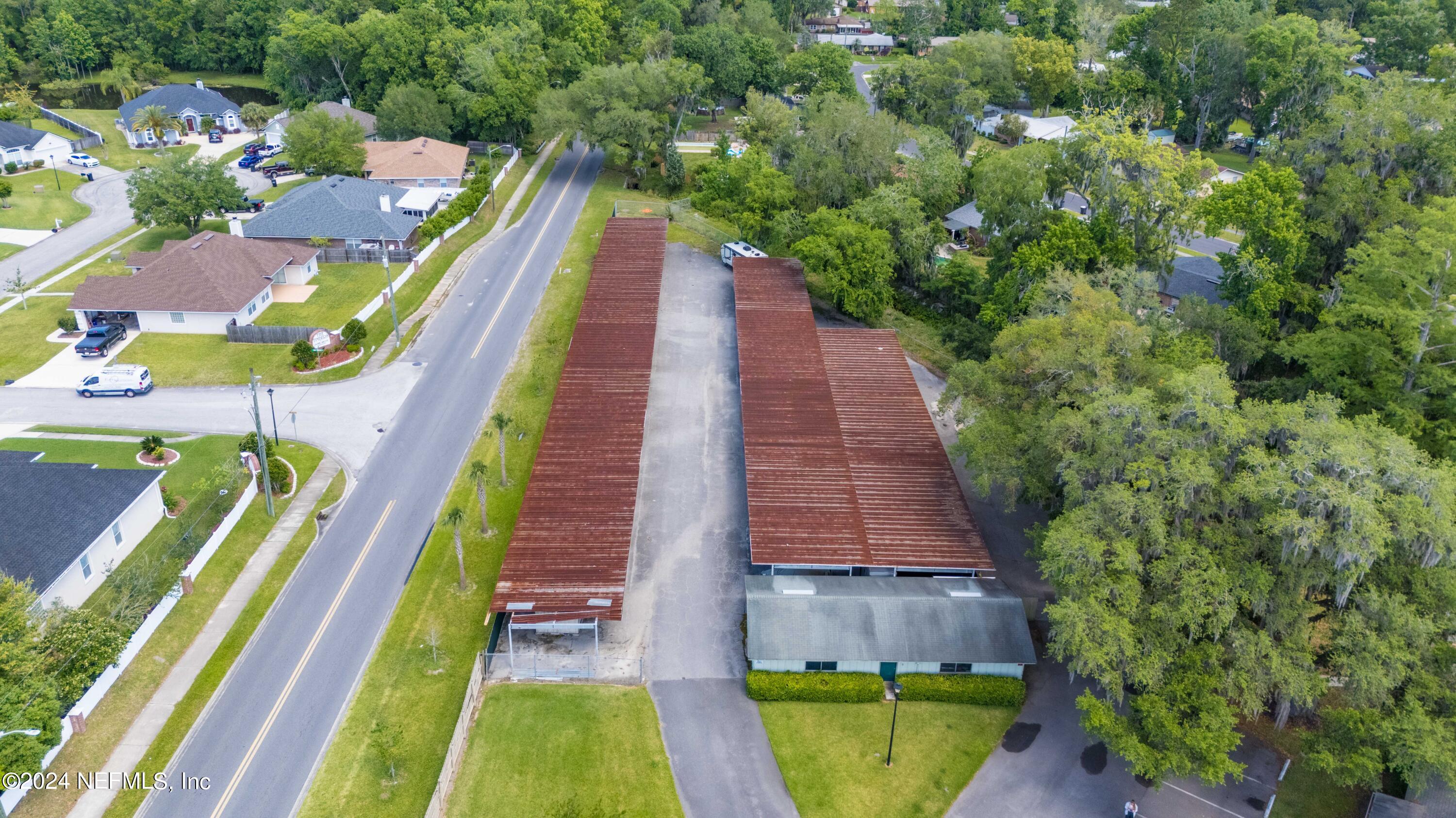 1283 The Grove Road Orange Park, FL 32073 - Photo 38 of 49 a aerial view of a house with a swimming pool