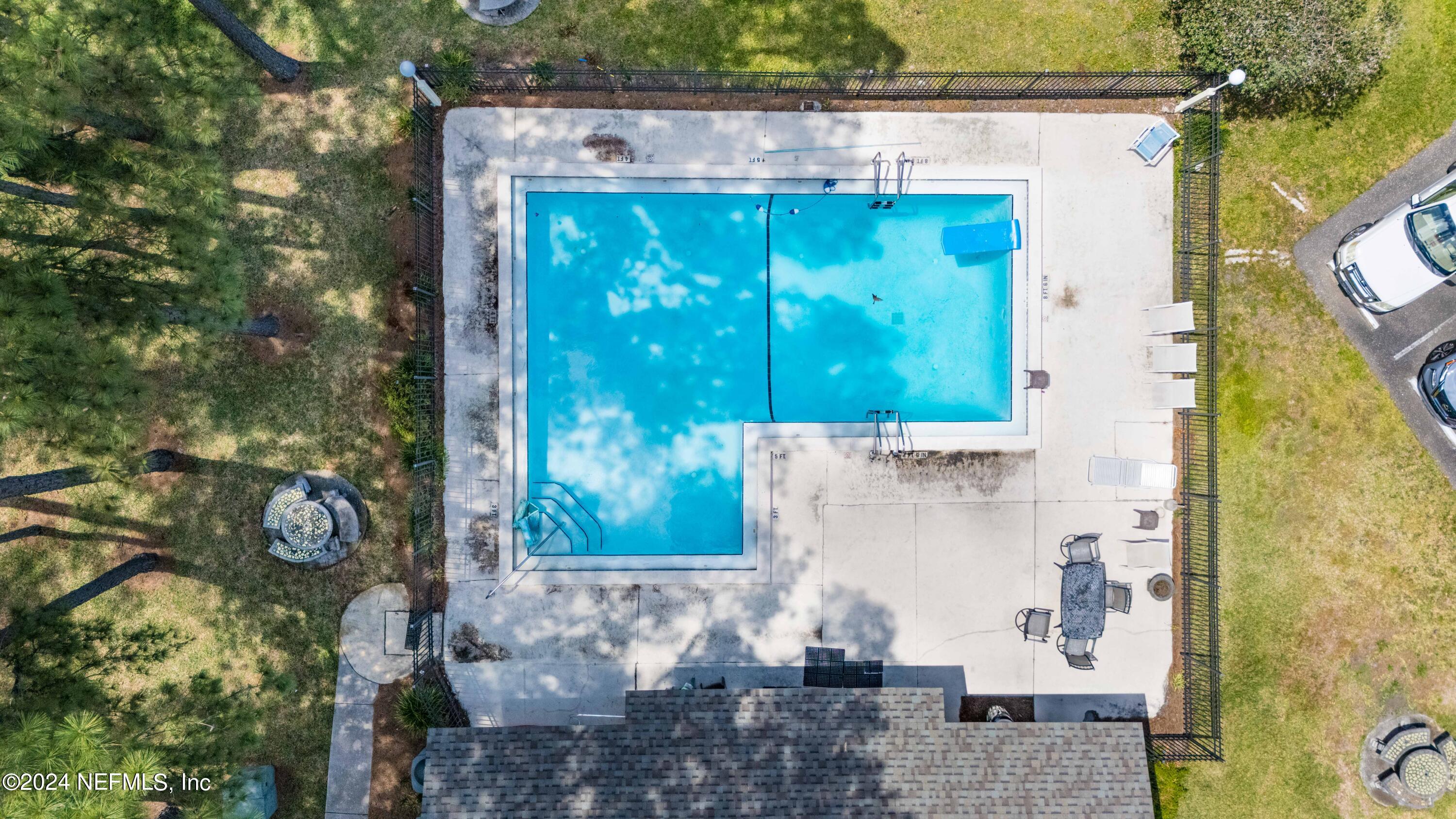 1283 The Grove Road Orange Park, FL 32073 - Photo 43 of 49 a small pool with some trees in the background