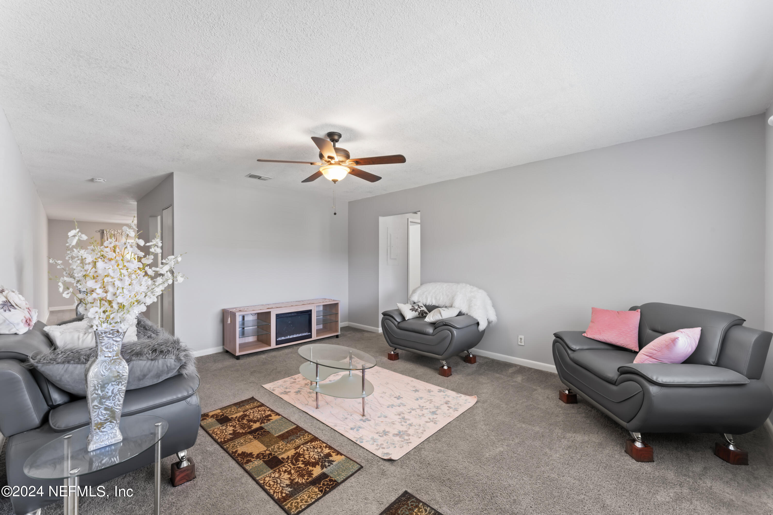 1283 The Grove Road Orange Park, FL 32073 - Photo 6 of 49 a living room with furniture and a rug