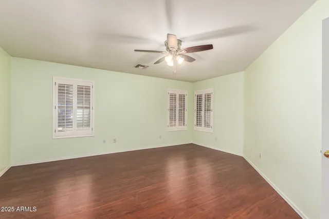 a bathroom with a granite countertop sink toilet a mirror and shower