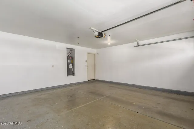 a view of a patio with table and chairs