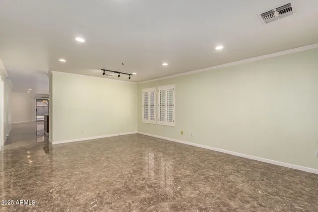 a view of an empty room with a window