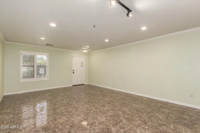 a view of an empty room with a window