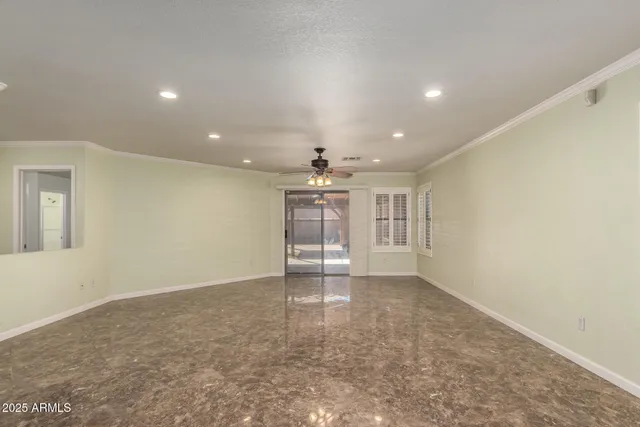 a living room with furniture and kitchen view