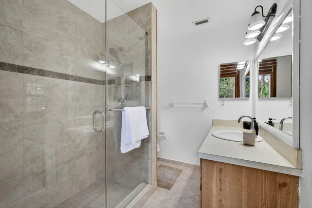 a view of a park with a large tree