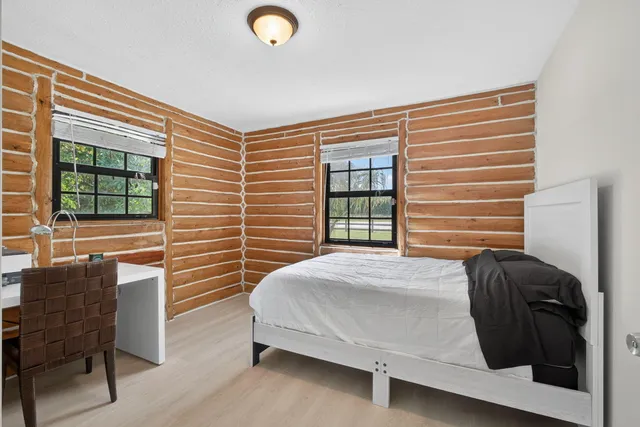 a view of a park with large trees