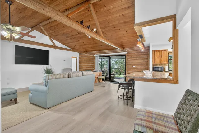 a dining room with a table and chairs