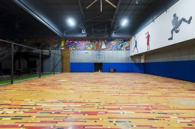 a room with lots of wooden cabinets and a wooden floors