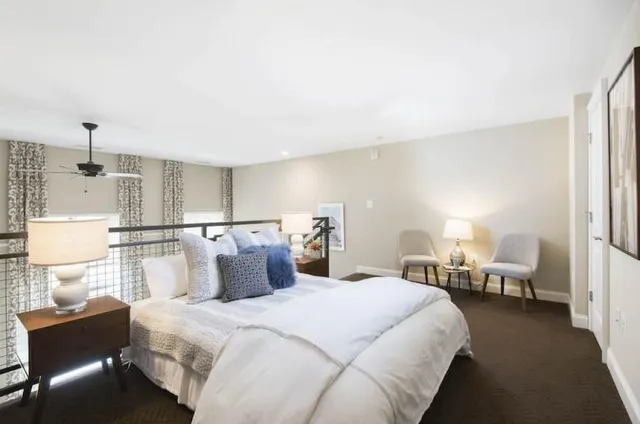 a bedroom with bed and window