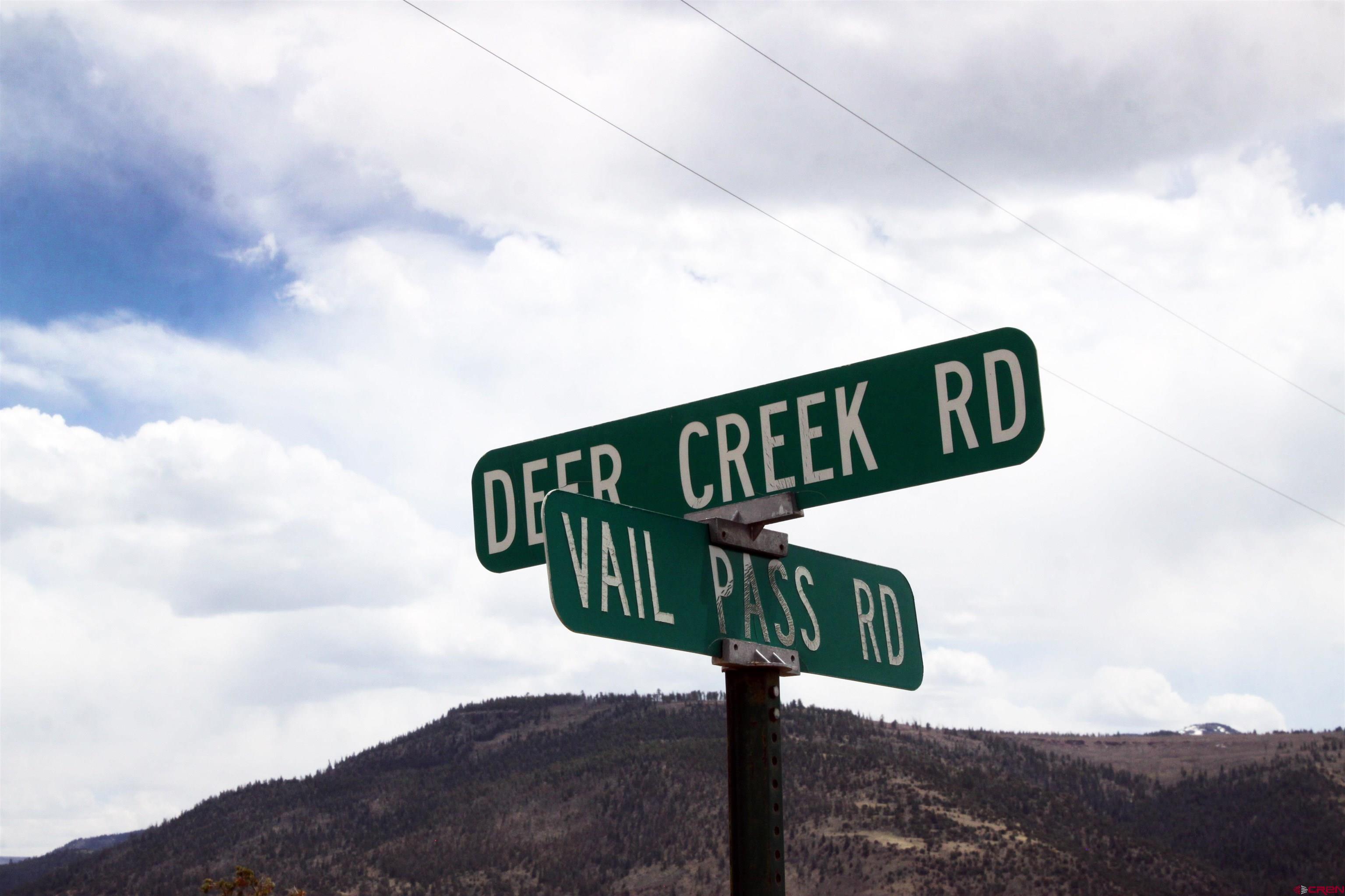877 Vail Pass Road South Fork, CO 81154 - Photo 22 of 25 a street sign sitting on top of a road