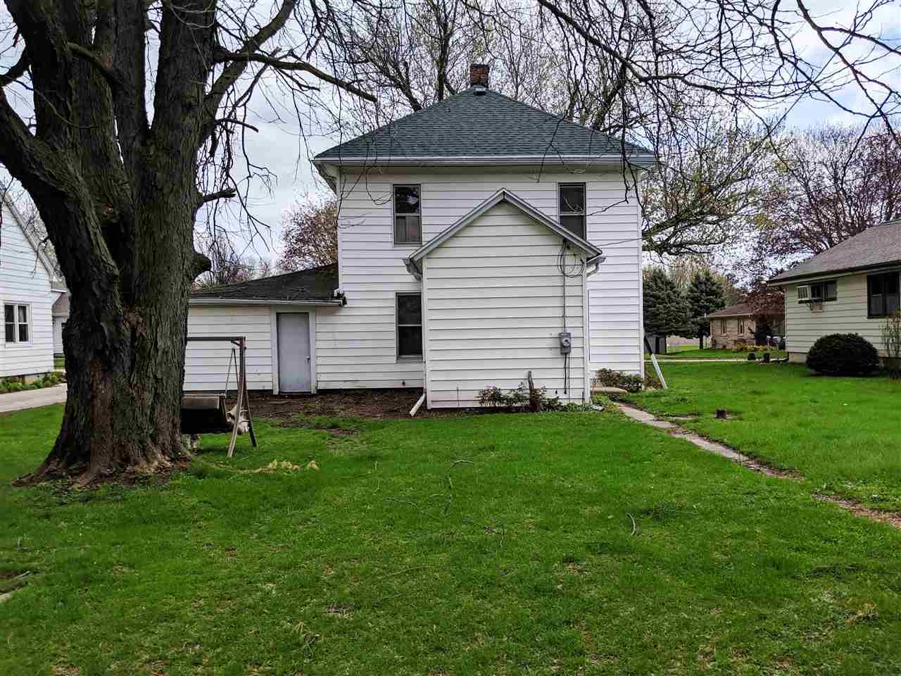 310 South Ridge Street Shannon, IL 61078 - Photo 15 of 15 a front view of a house with a garden