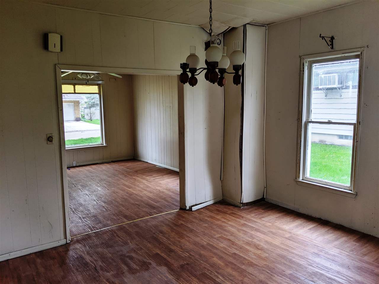 310 South Ridge Street Shannon, IL 61078 - Photo 6 of 15 wooden floor in an empty room with a window