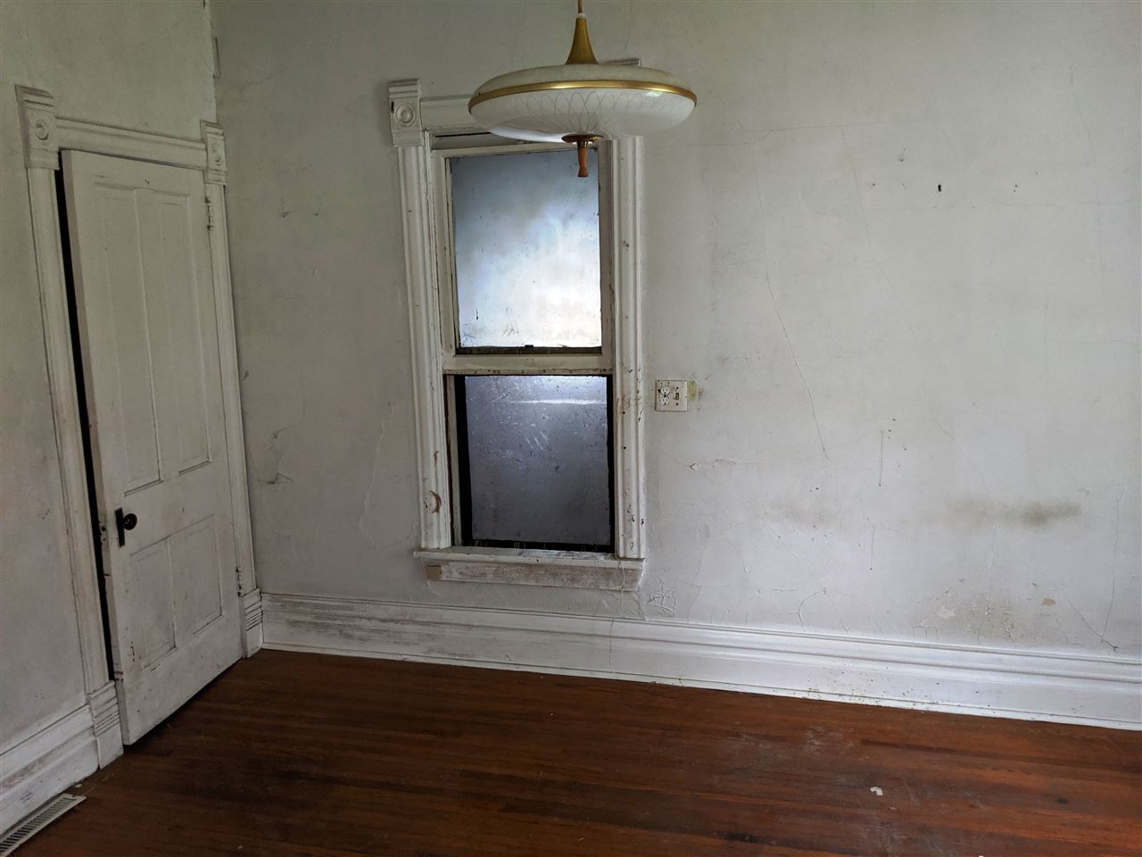 310 South Ridge Street Shannon, IL 61078 - Photo 8 of 15 a view of an empty room with wooden floor and closet
