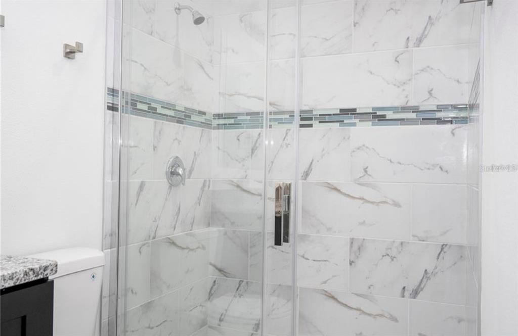 9809 North Swanee Terrace Citrus Springs, FL 34433 - Photo 26 of 46 a bathroom with a shower