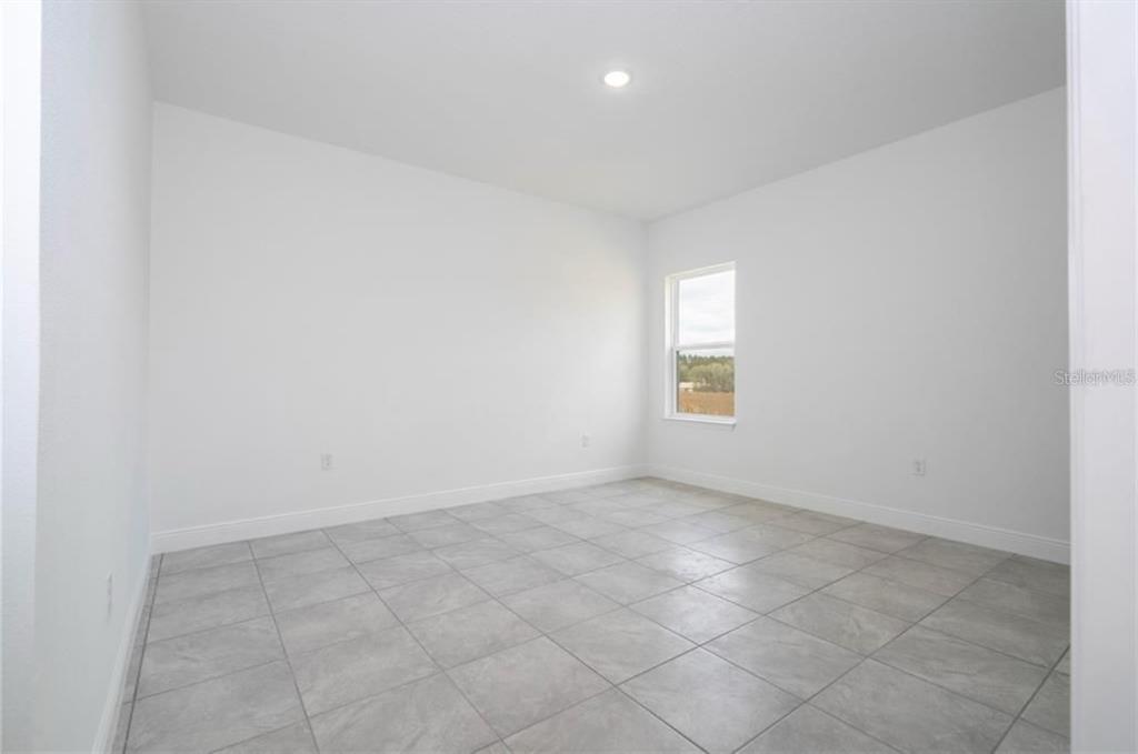 9809 North Swanee Terrace Citrus Springs, FL 34433 - Photo 27 of 46 an empty room with windows