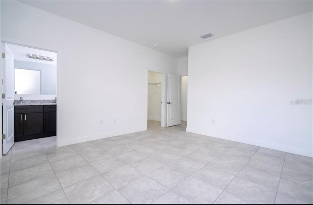 9809 North Swanee Terrace Citrus Springs, FL 34433 - Photo 28 of 46 a view of an empty room with window and cabinet