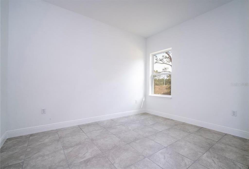 9809 North Swanee Terrace Citrus Springs, FL 34433 - Photo 43 of 46 an empty room with a window