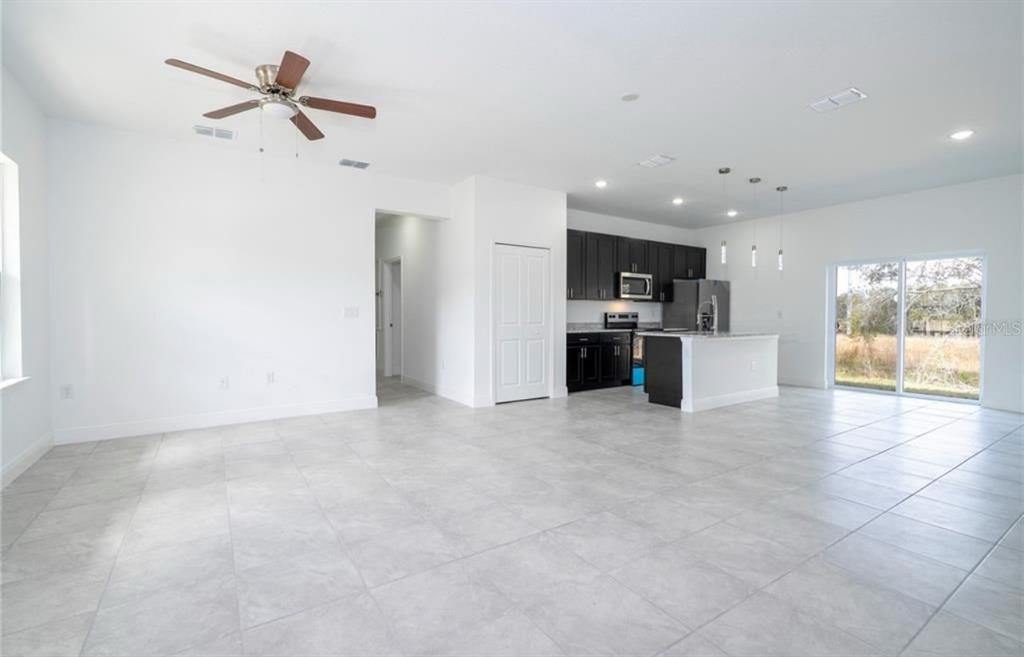 9809 North Swanee Terrace Citrus Springs, FL 34433 - Photo 8 of 46 a view of a kitchen with a stove cabinets and a kitchen