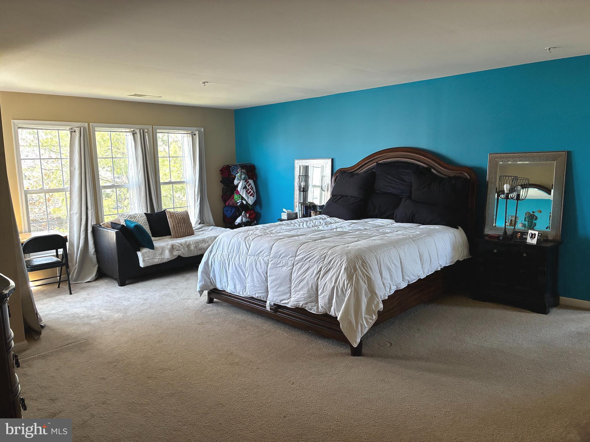 14301 Lightfoot Street Accokeek, MD 20607 - Photo 15 of 32 a bedroom with a bed and a couch