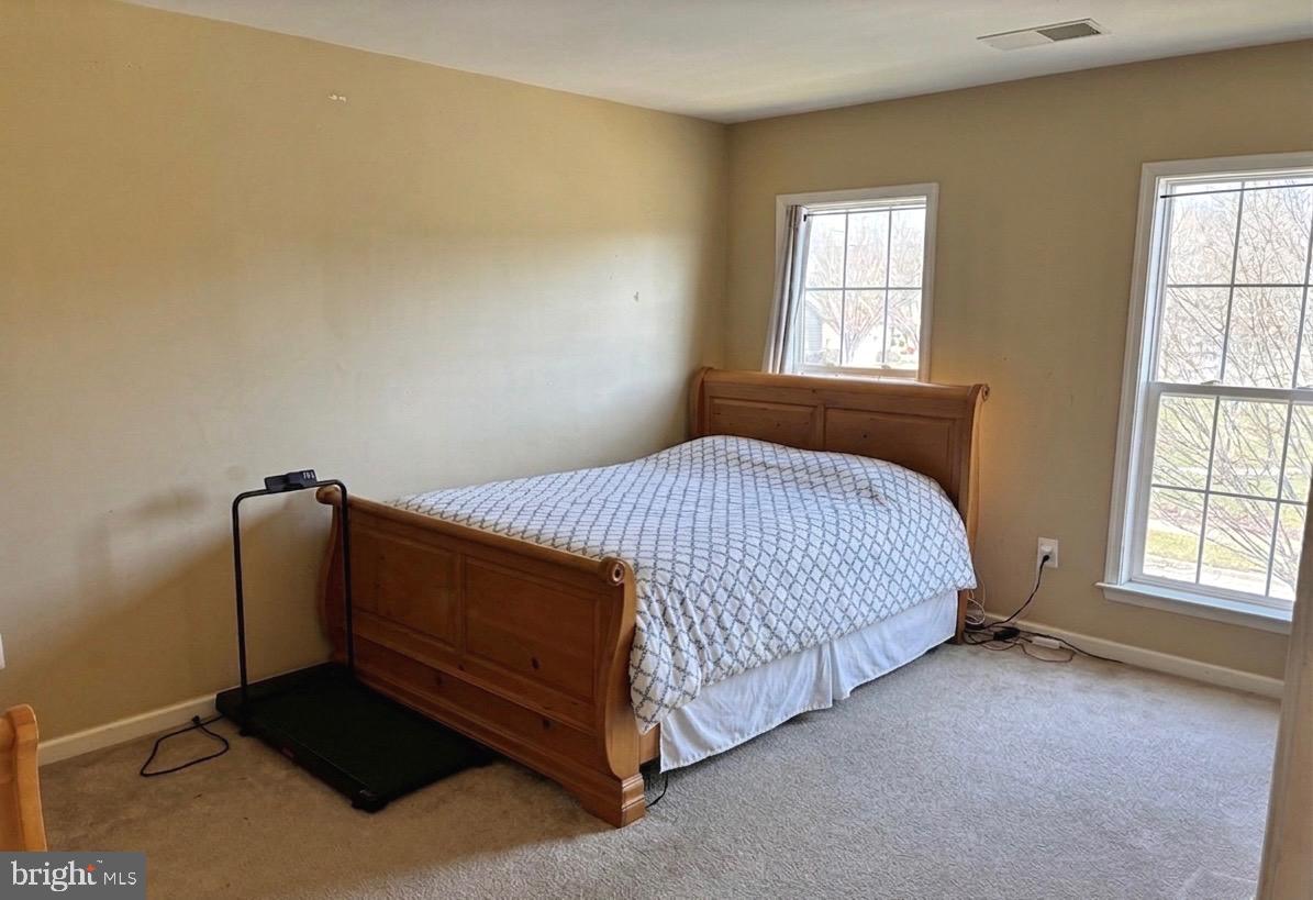 14301 Lightfoot Street Accokeek, MD 20607 - Photo 19 of 32 a bedroom with a bed and window