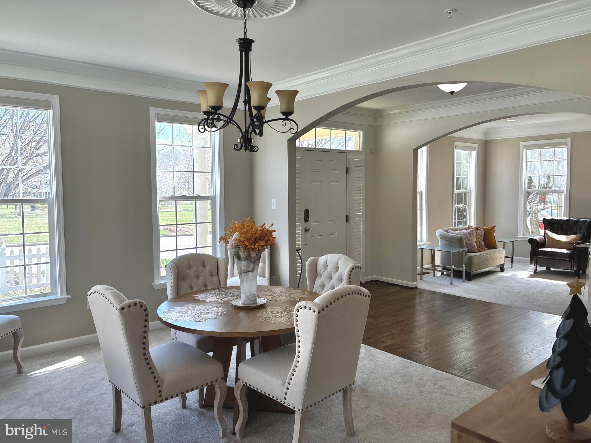 14301 Lightfoot Street Accokeek, MD 20607 - Photo 2 of 32 a view of a dining room with furniture window and wooden floor