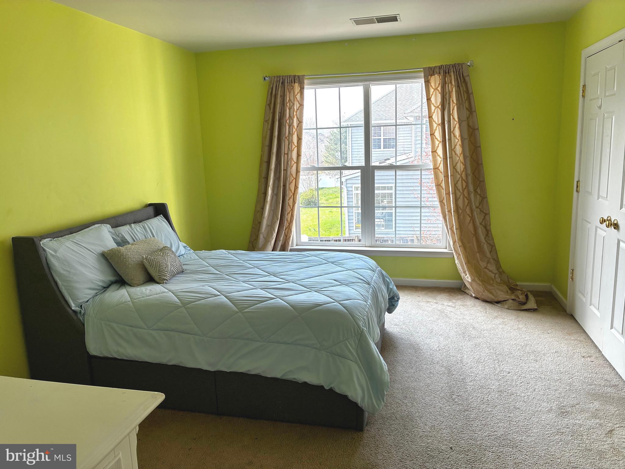 14301 Lightfoot Street Accokeek, MD 20607 - Photo 21 of 32 a bedroom with a bed and a window