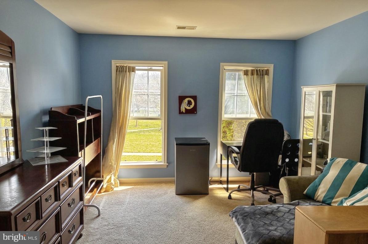 14301 Lightfoot Street Accokeek, MD 20607 - Photo 22 of 32 a living room with furniture and a window