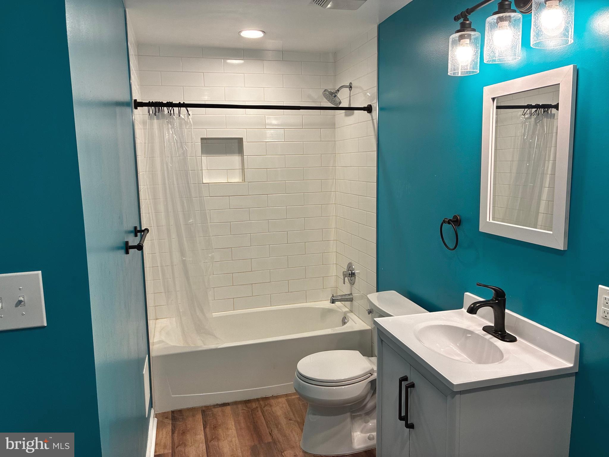 14301 Lightfoot Street Accokeek, MD 20607 - Photo 24 of 32 a bathroom with a sink toilet and shower