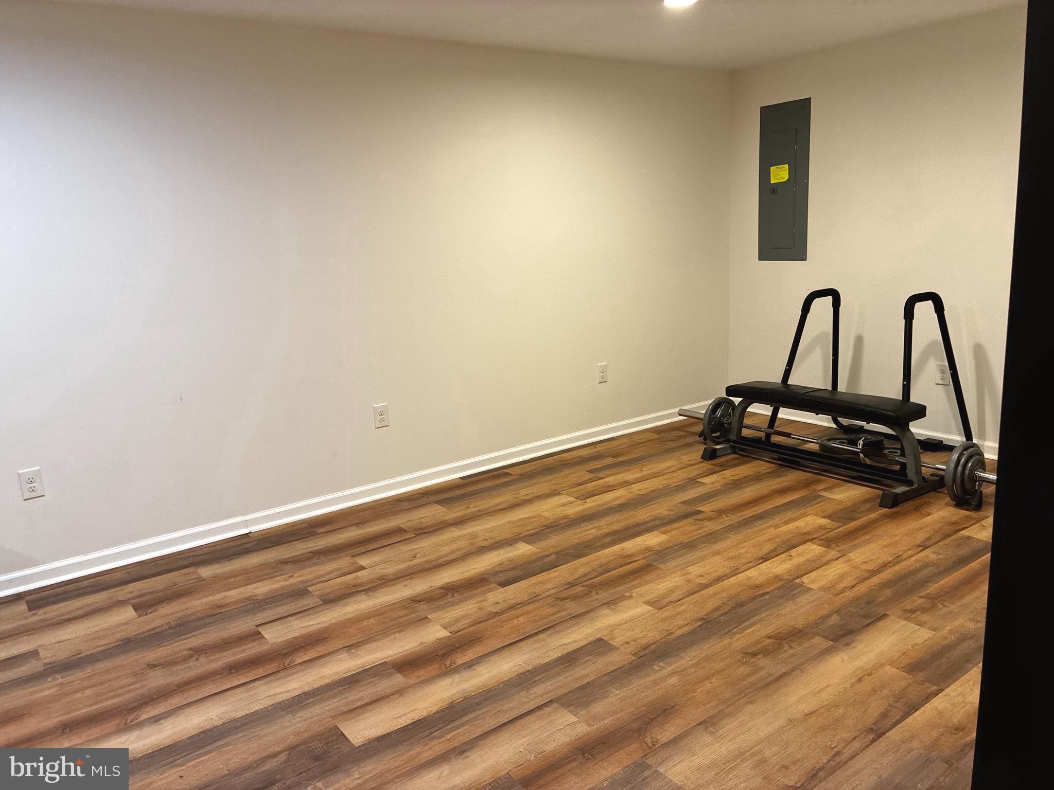 14301 Lightfoot Street Accokeek, MD 20607 - Photo 25 of 32 a view of a room with gym equipment