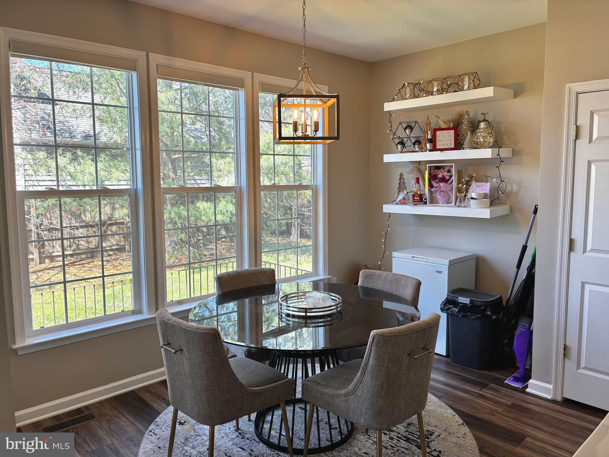 14301 Lightfoot Street Accokeek, MD 20607 - Photo 9 of 32 a dining room with furniture a rug and wooden floor